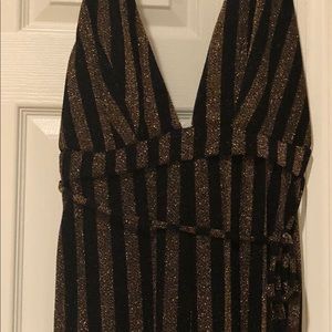 Sparkly black and gold fashion move jumpsuit